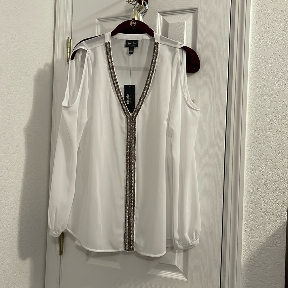 Nicole long sleeve top with off shoulder entry.